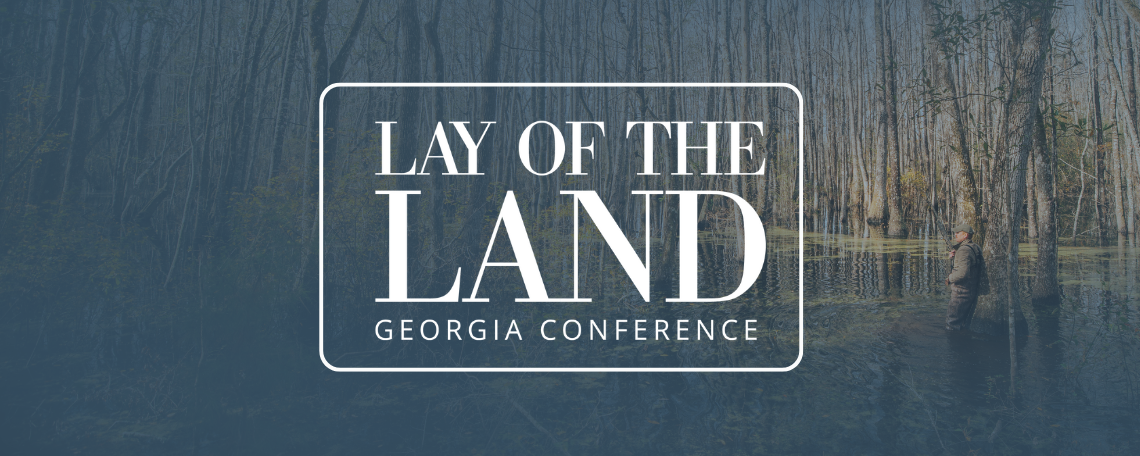 georgia land conference logo over some young pine stands